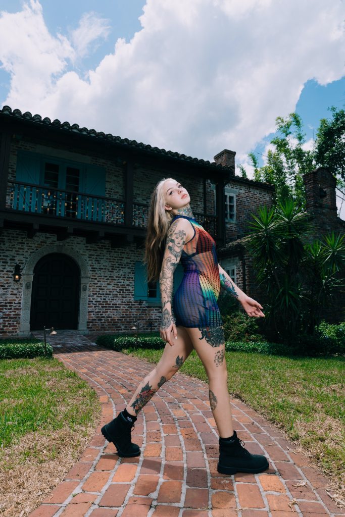 Photo by Jacob Sierra: https://www.pexels.com/photo/woman-wearing-a-multicoloured-bodysuit-and-tattoos-posing-on-a-patio-16420200/