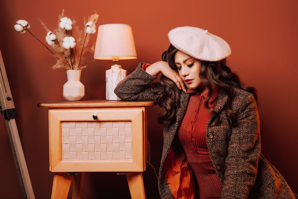 Photo by Josue Velasquez: https://www.pexels.com/photo/woman-in-retro-clothes-on-red-wall-background-13026931/