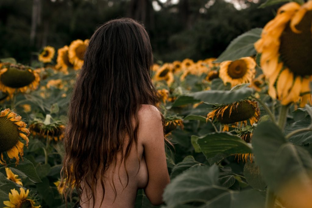 Photo by Lola Russian: https://www.pexels.com/photo/photo-of-topless-woman-near-sunflowers-2704051/