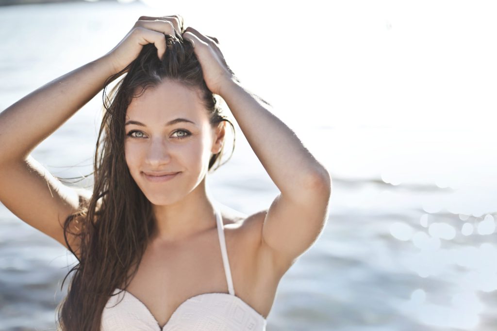 Photo by Andrea Piacquadio from Pexels: https://www.pexels.com/photo/woman-in-white-bikini-top-smiling-3812755/